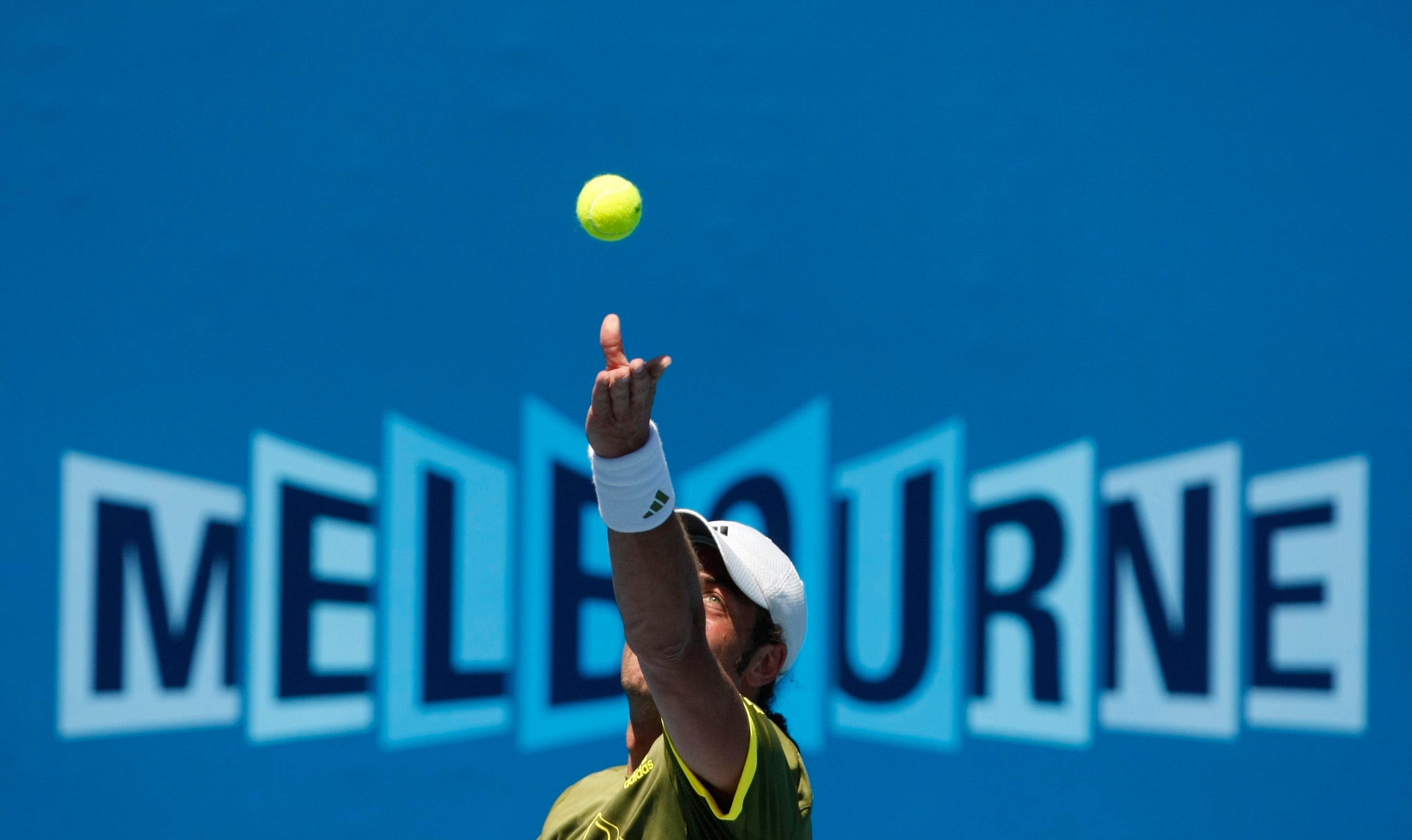 Chile's Massu serves to Spain's Almagro during their match at the Australian Open tennis tournament in Melbourne