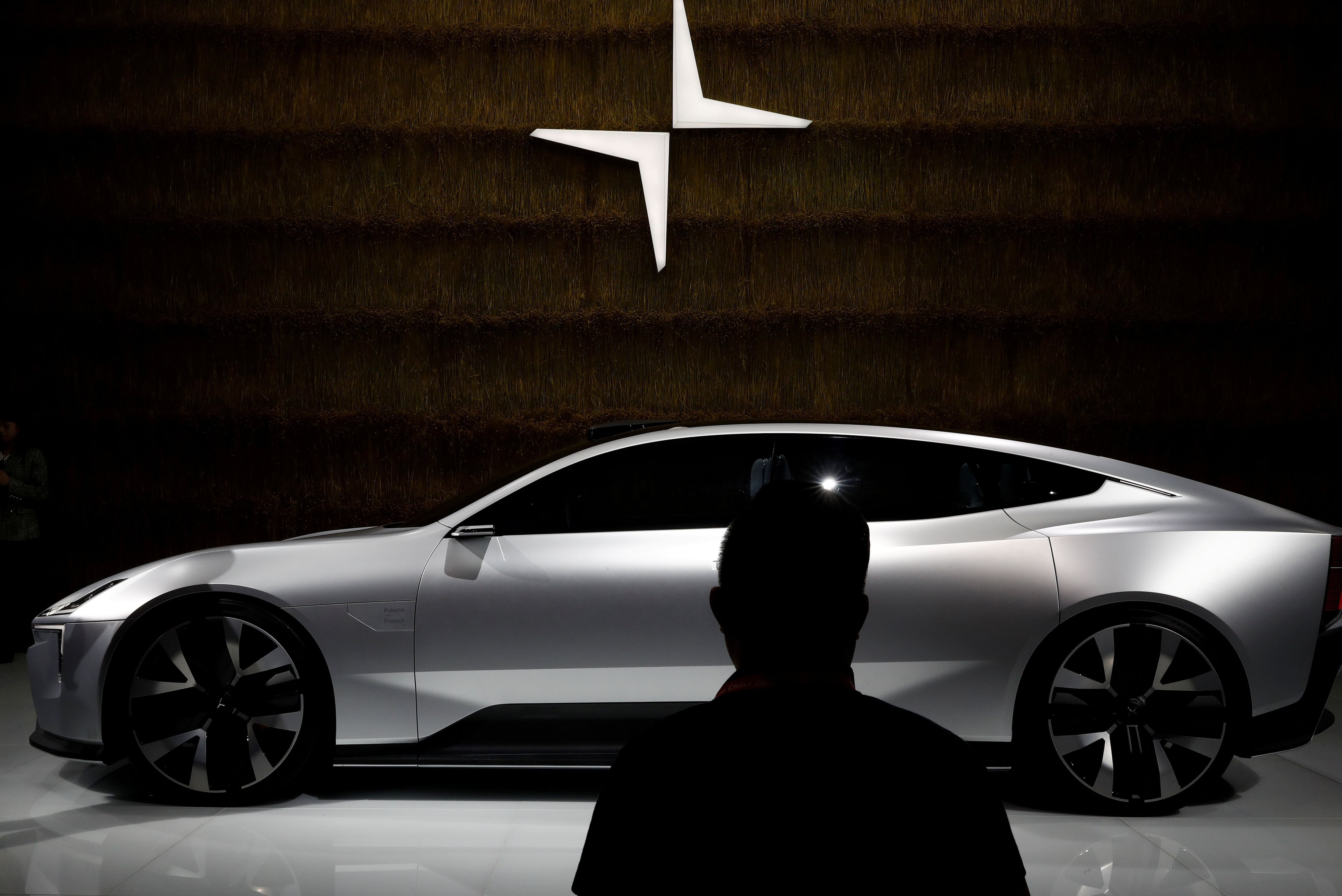 FILE PHOTO: A man looks at a Polestar Precept car at the Beijing International Automotive Exhibition