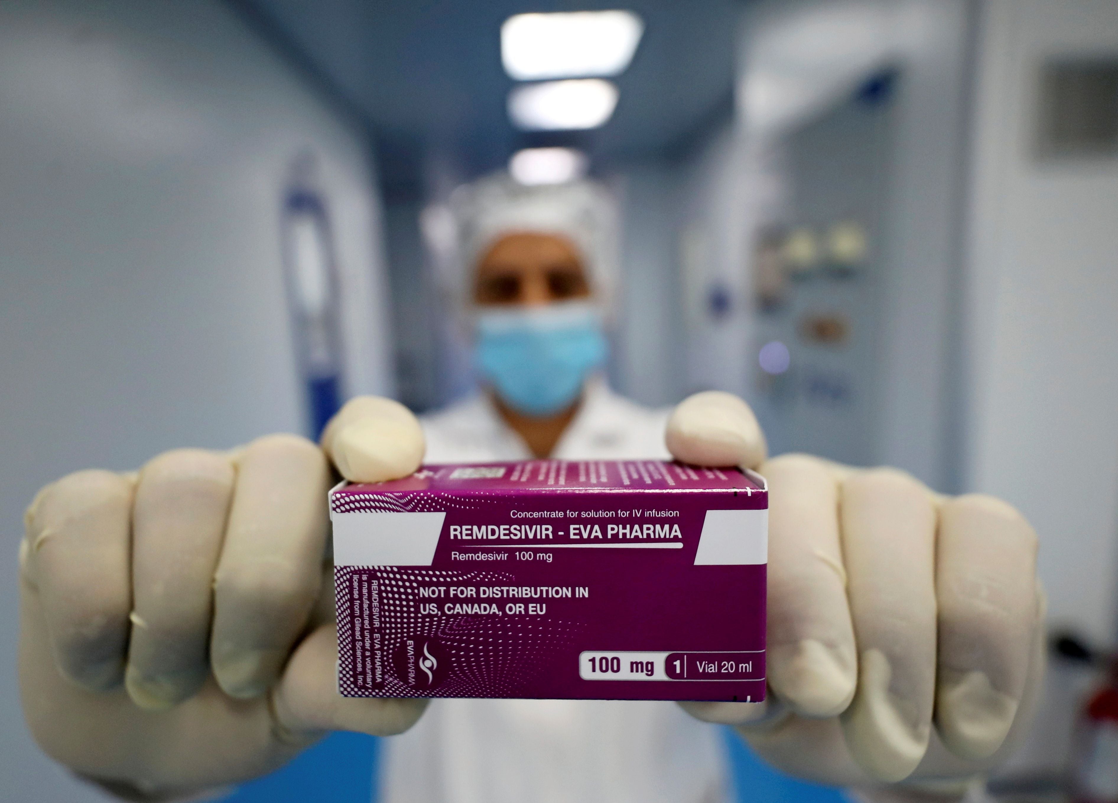 A laboratory technician shows Remdesivir at Eva Pharma facility in Cairo