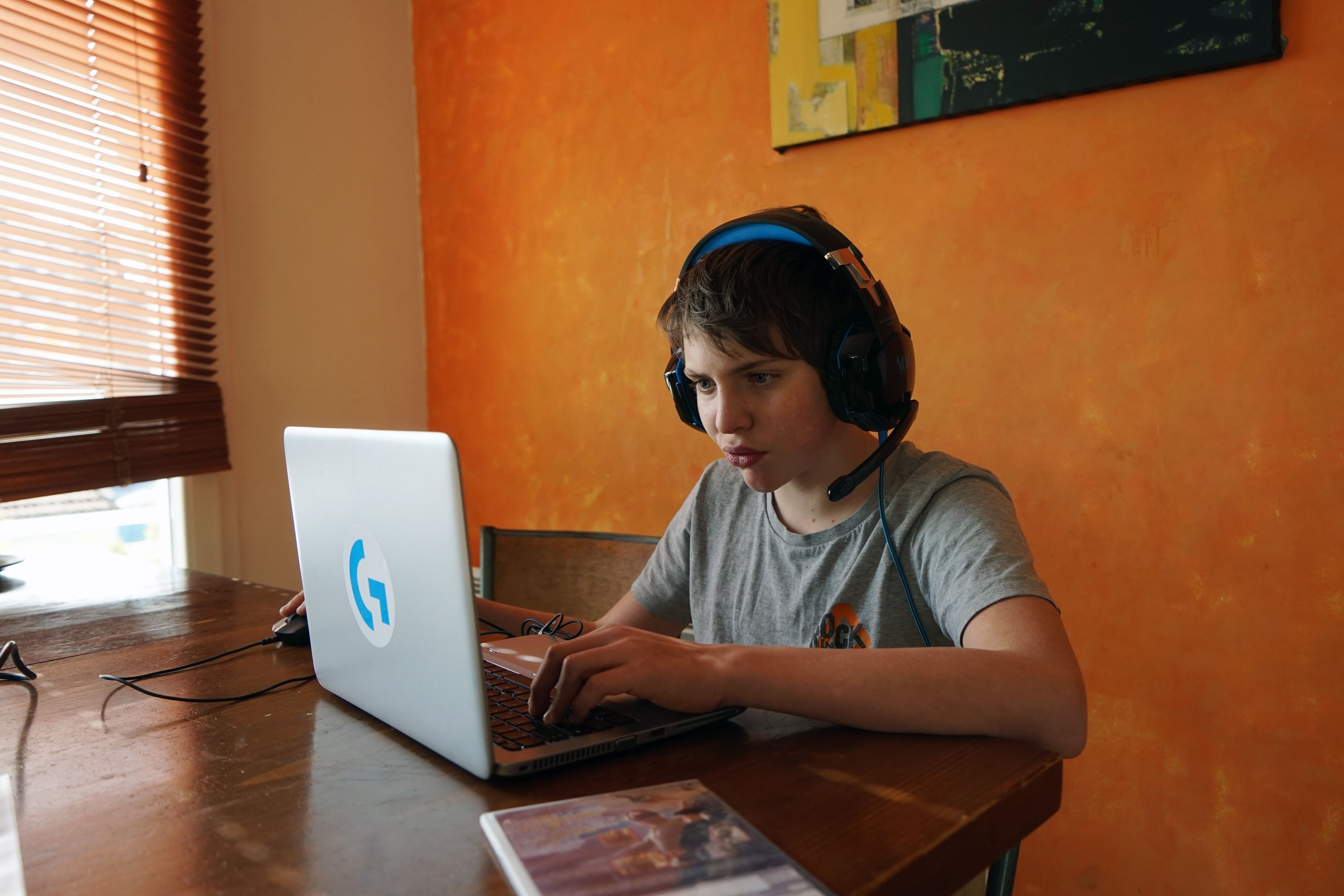 FRANCE -  KID PLAYING VIDEOGAME DURING LOCKDOWN