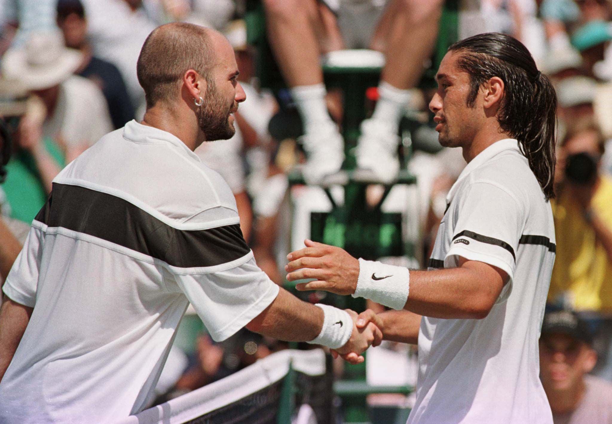 AGASSI CONGRATULATES RIOS ON VICTORY IN LIPTON FINAL