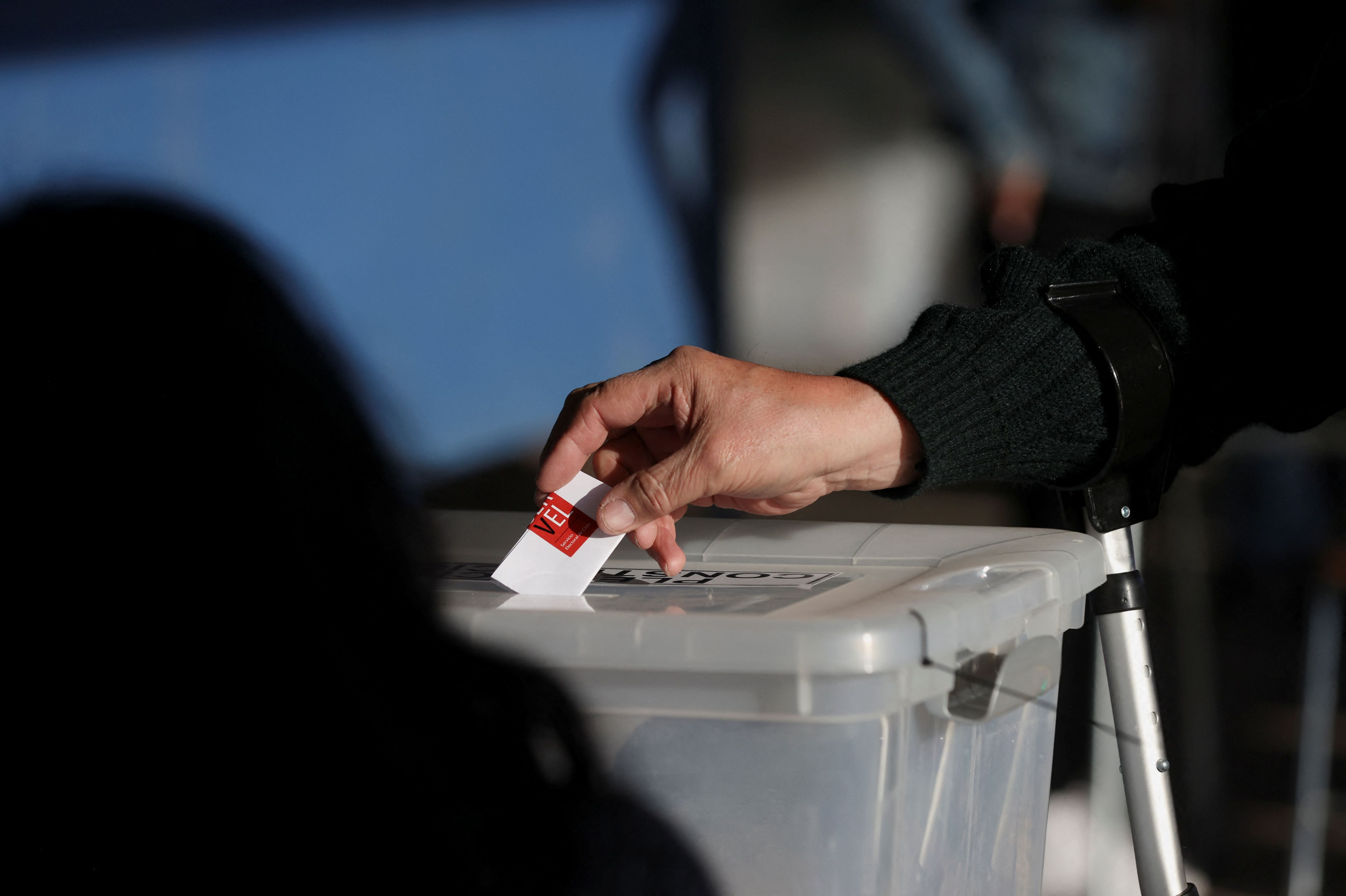 Chileans vote in a mandatory plebiscite to approve or reject the new Constitution