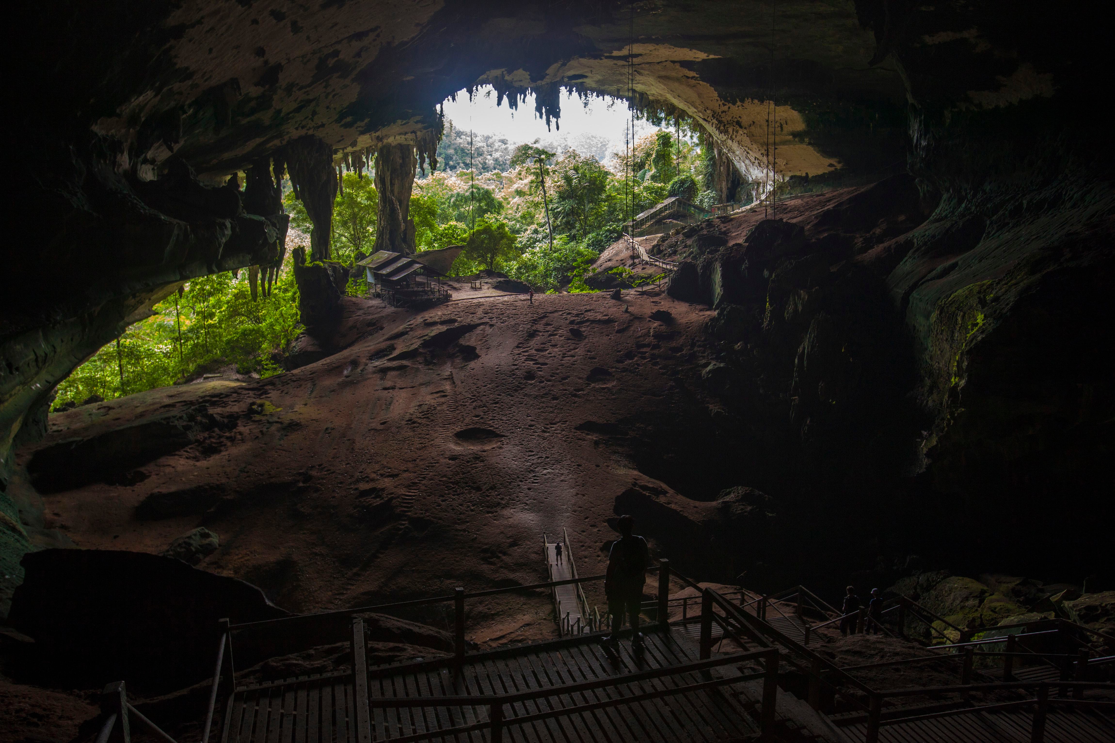 Tourists view the main entrance of the Niah Great Cave, at the Niah National Park in the Malaysian state of Sarawak in Borneo island