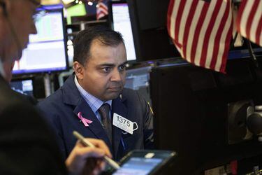 Specialist Dilip Patel works at the New York Stock Exchange