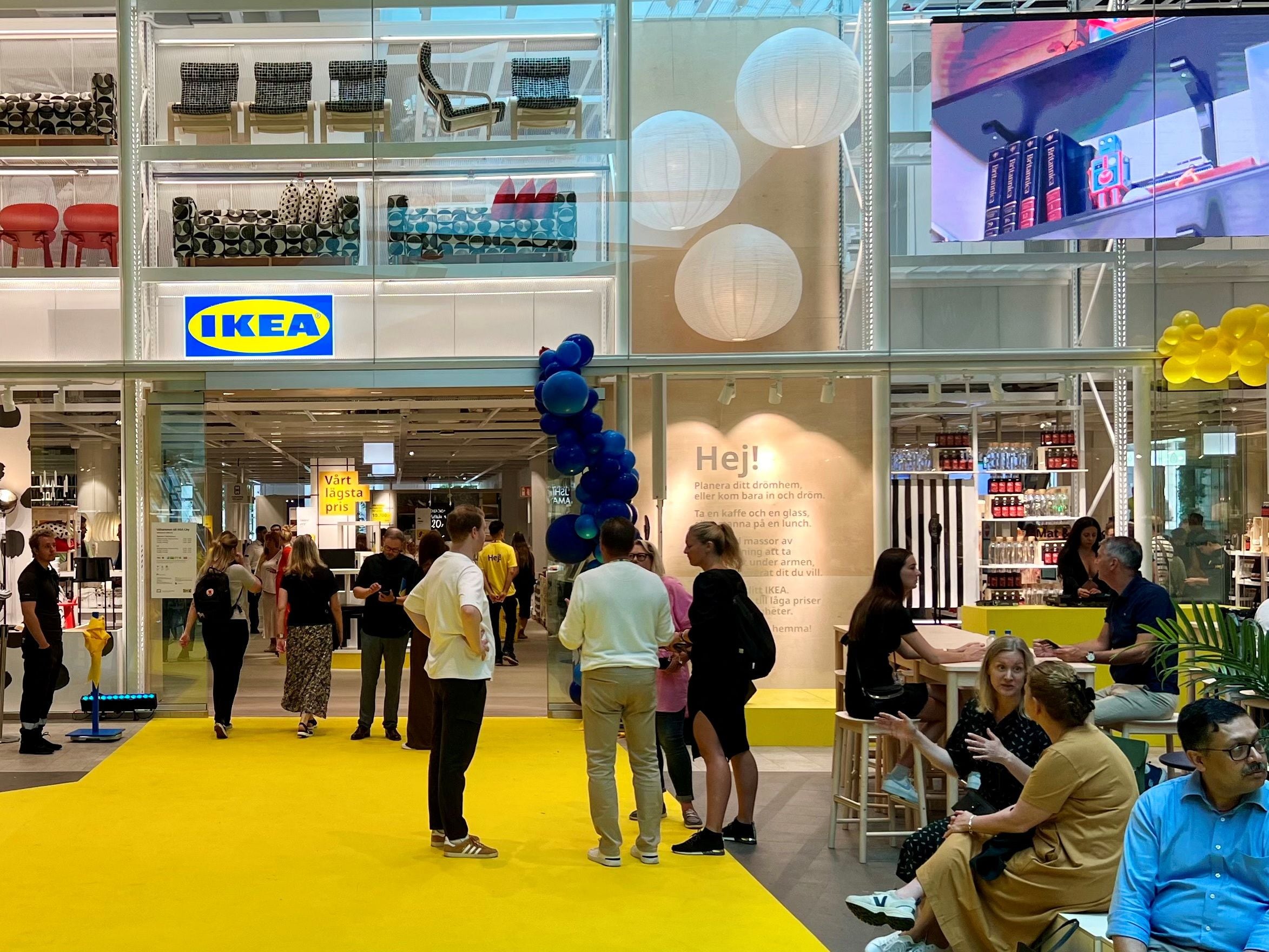 People enter an inner-city IKEA store on its opening day in Stockholm