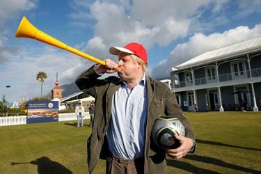FILE PHOTO: London Mayor Boris Johnson blows a vuvuzela during his visit to Waterfront in Cape Town