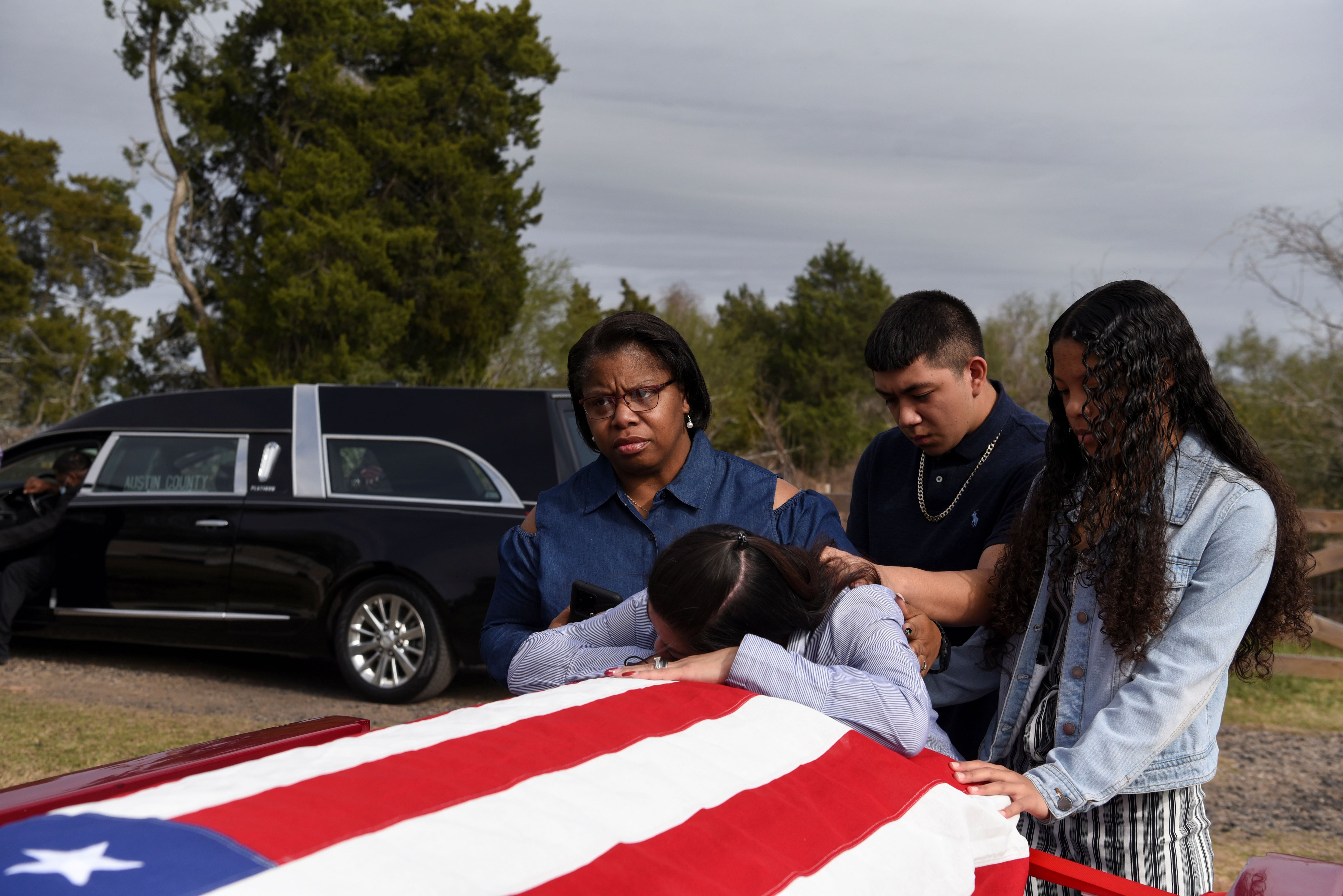 The Wider Image: 'I just ask God to help me': Texas funeral home crushed by death as U.S. COVID toll nears 500,000