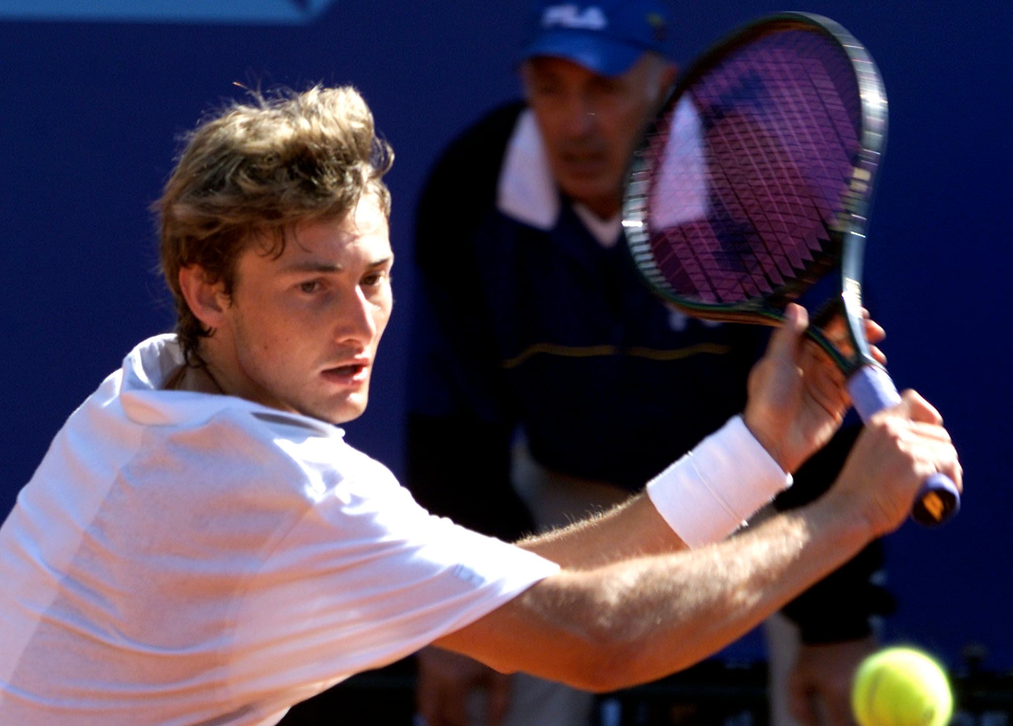 SPAIN'S JUAN CARLOS FERRERO RETURNS THE BALL TO ARGENTINA'S FRANCO SQUILLARI IN THE MONTE CARLO TENNIS OPEN.