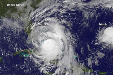 Hurricane Matthew is seen to the west of a much smaller Hurricane Nicole in this image from NOAA's GOES-East satellite