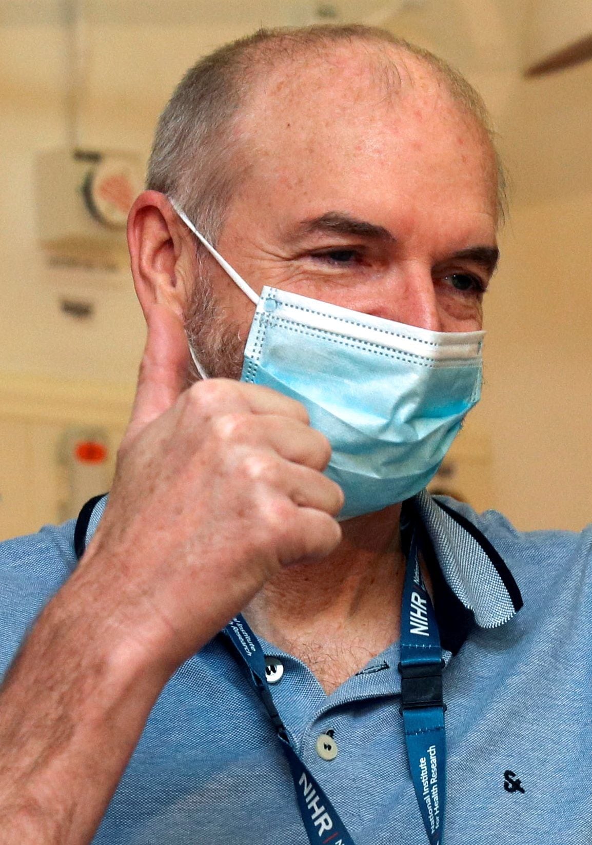 FILE PHOTO: Professor Andrew Pollard receives the Oxford University/AstraZeneca COVID-19 vaccine at the Churchill Hospital in Oxford