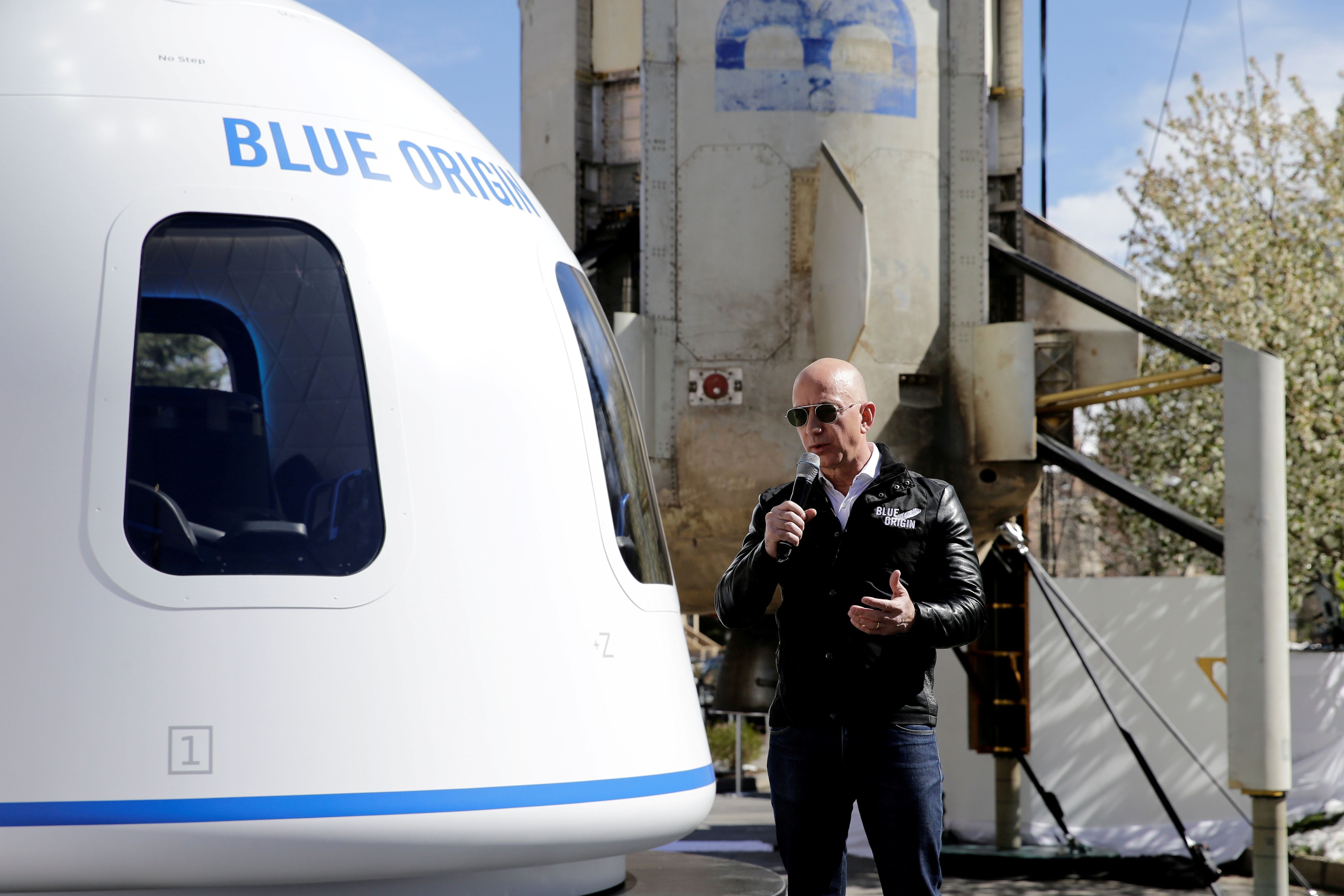 Amazon and Blue Origin founder Jeff Bezos addresses the media about the New Shepard rocket booster and Crew Capsule mockup at the 33rd Space Symposium in Colorado Springs.