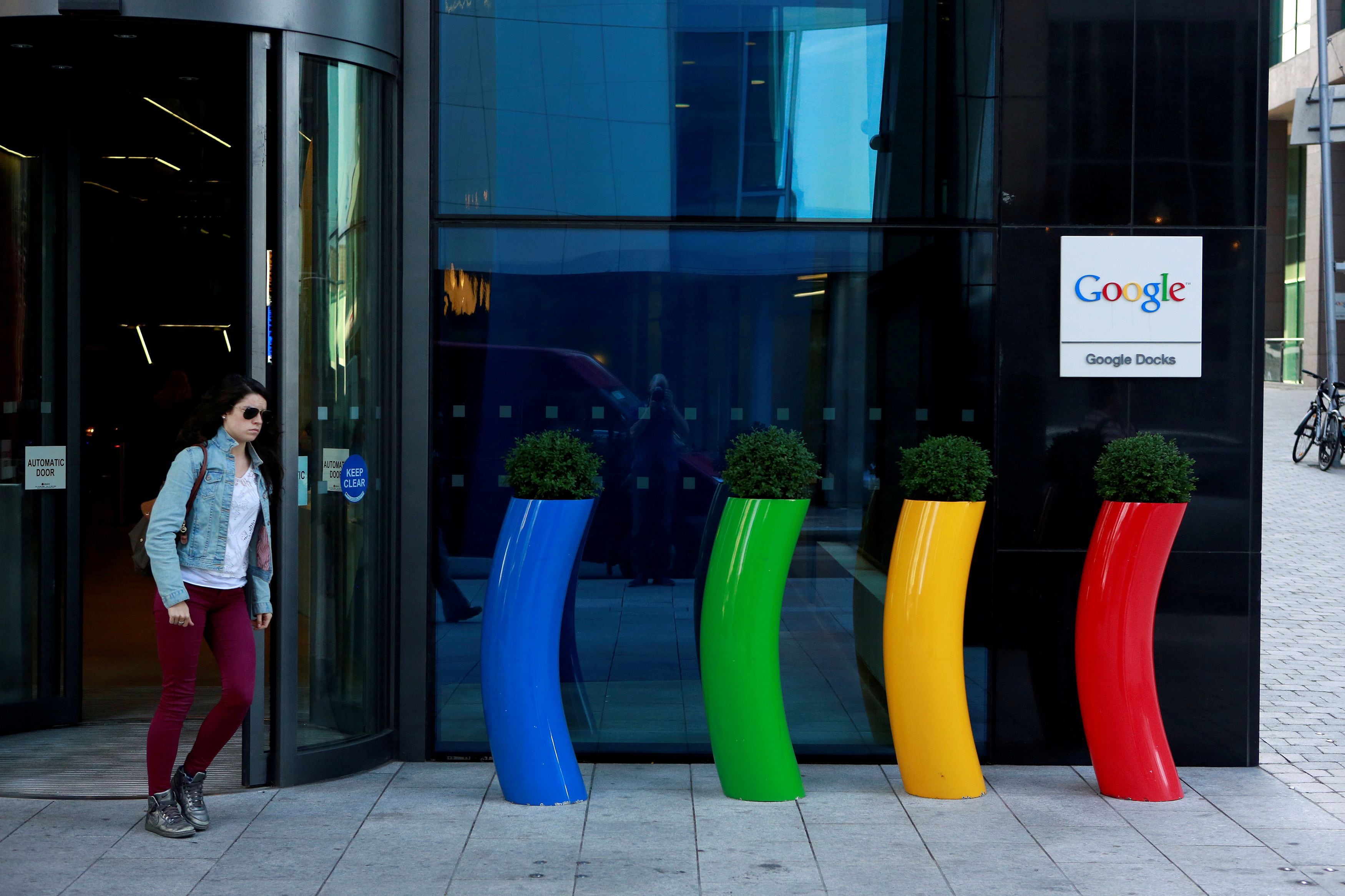 FILE PHOTO: A woman walks past the Google offices near the city centre in Dublin