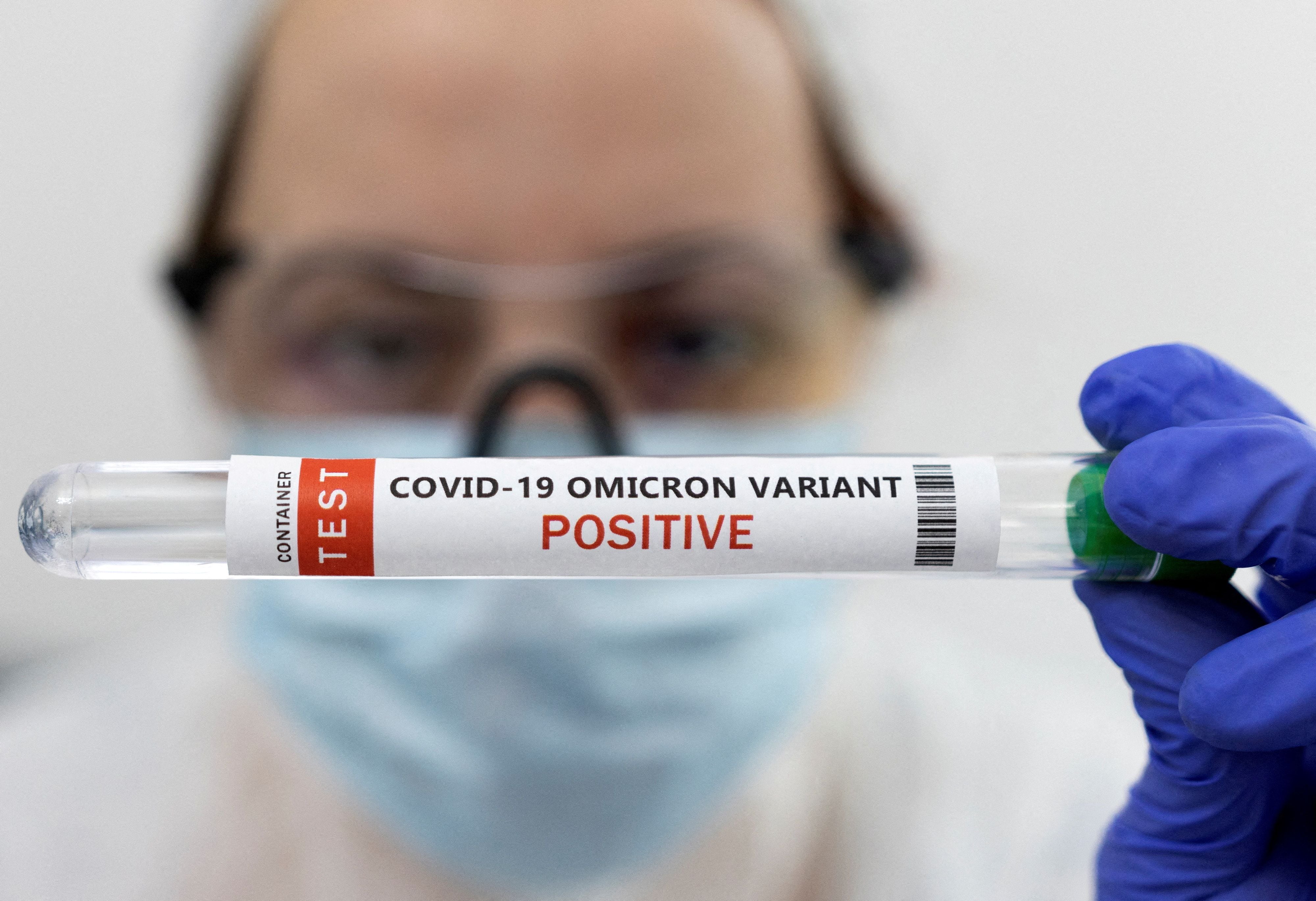 FILE PHOTO: Illustration shows test tube labelled "COVID-19 Omicron variant test positive\