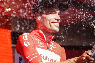 Dutch cyclist Tom Dumoulin from Team Sunweb sprays champagne as he ce
