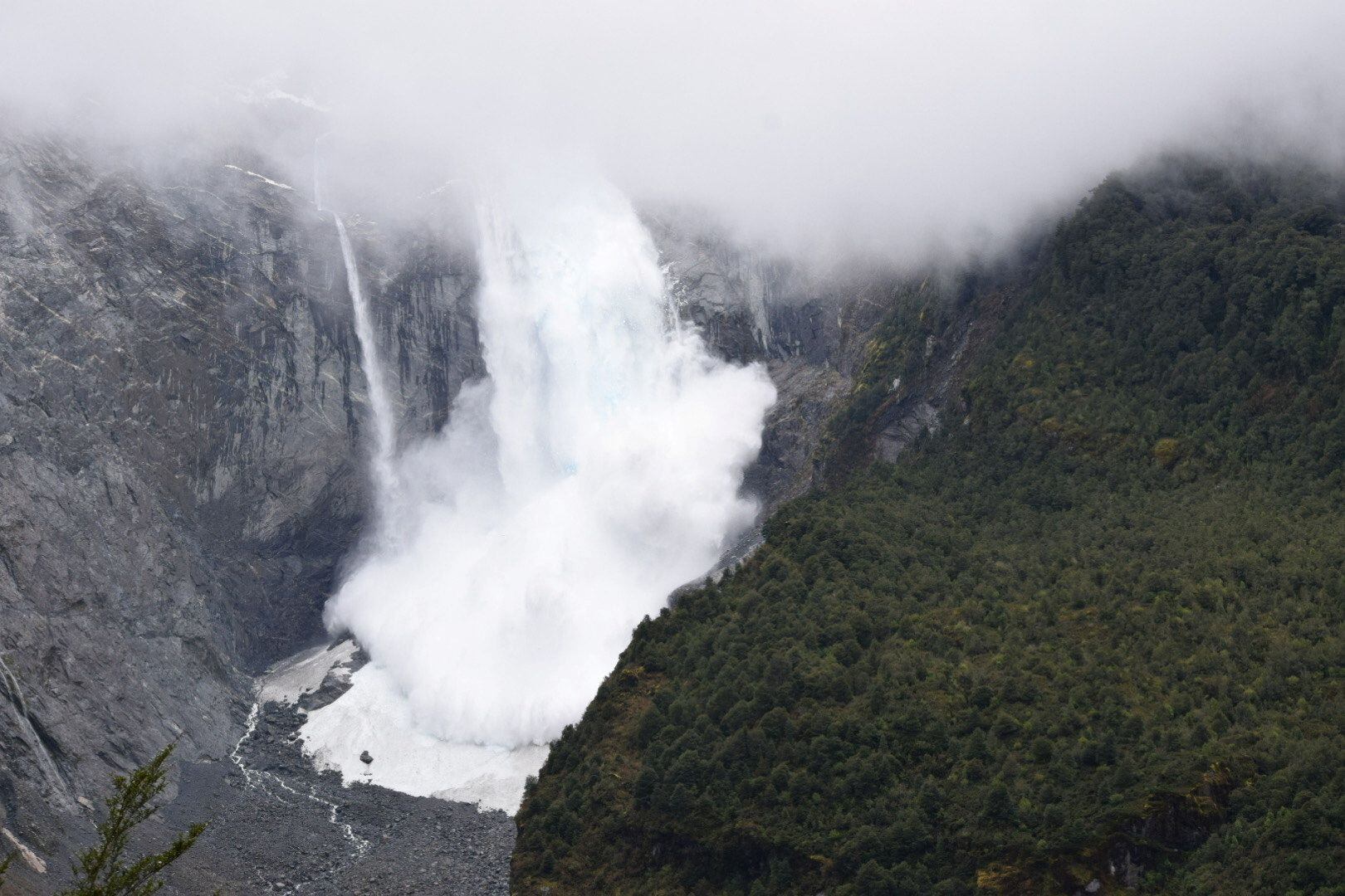 A glacier is pictured calving into the river, in Queulat National Park, in Aysen