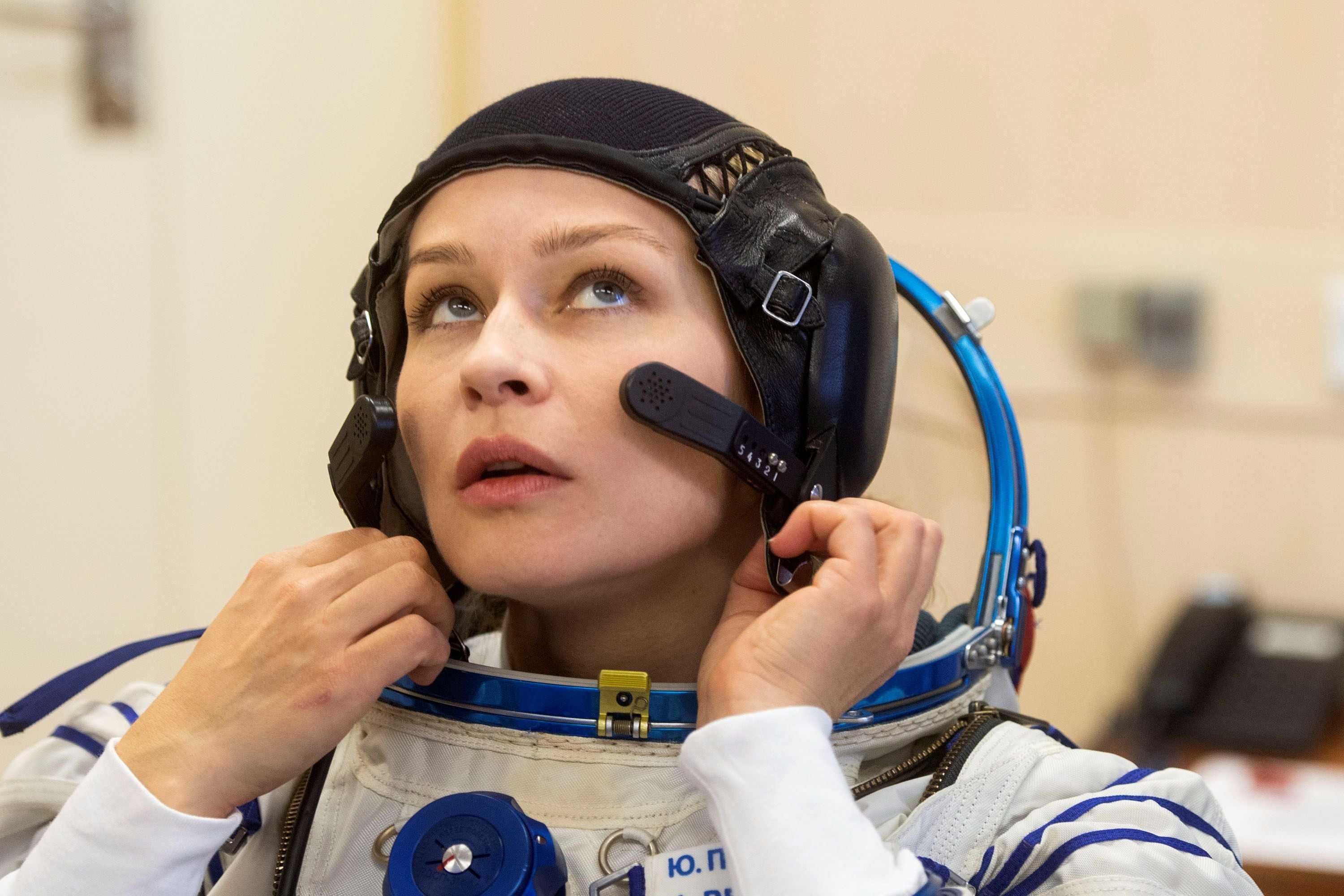 The International Space Station (ISS) crew members attend space suit check at the Baikonur Cosmodrome