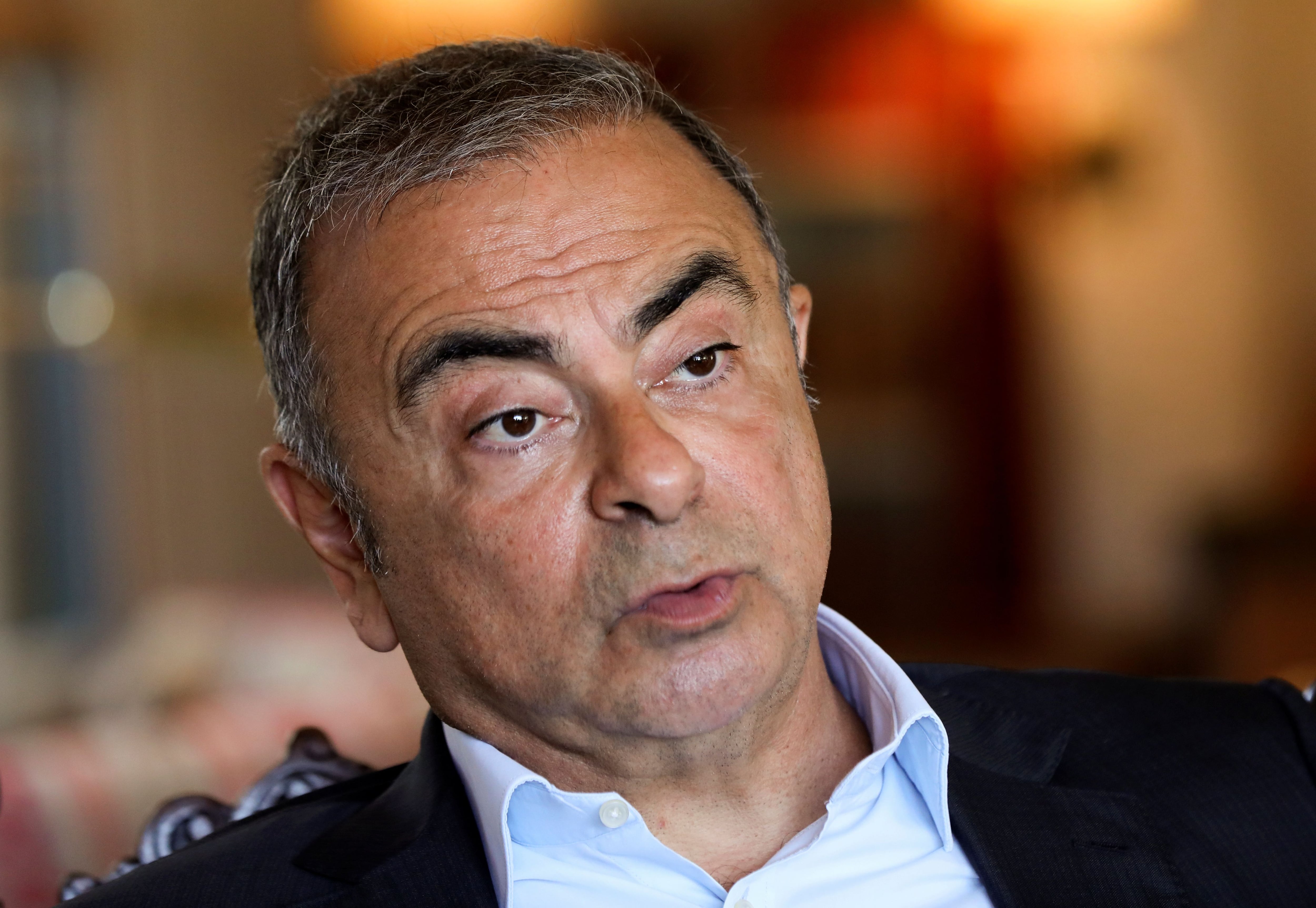 Fugitive former car executive Carlos Ghosn, talks during an interview with Reuters in Beirut