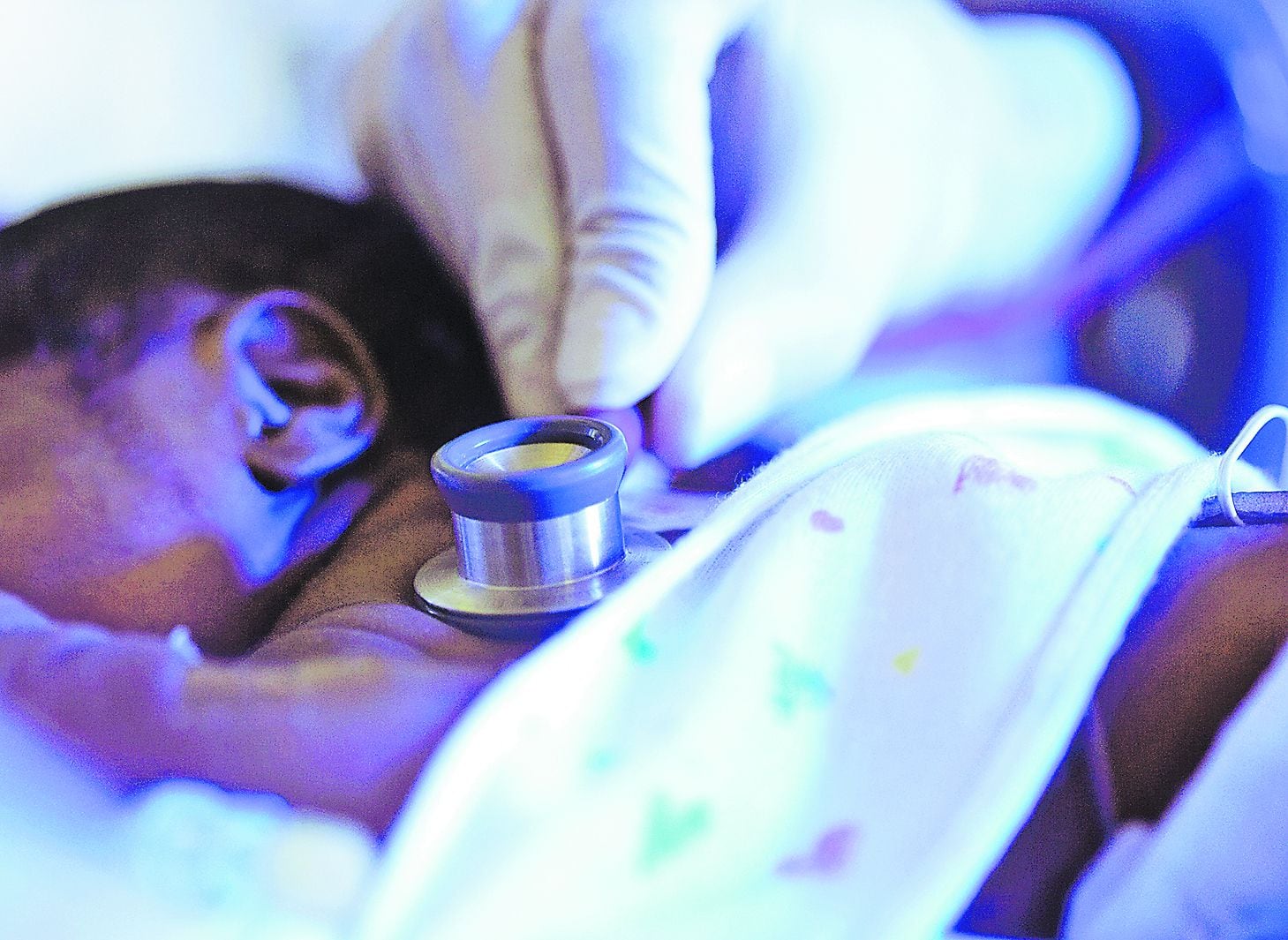 African American premature baby being examined