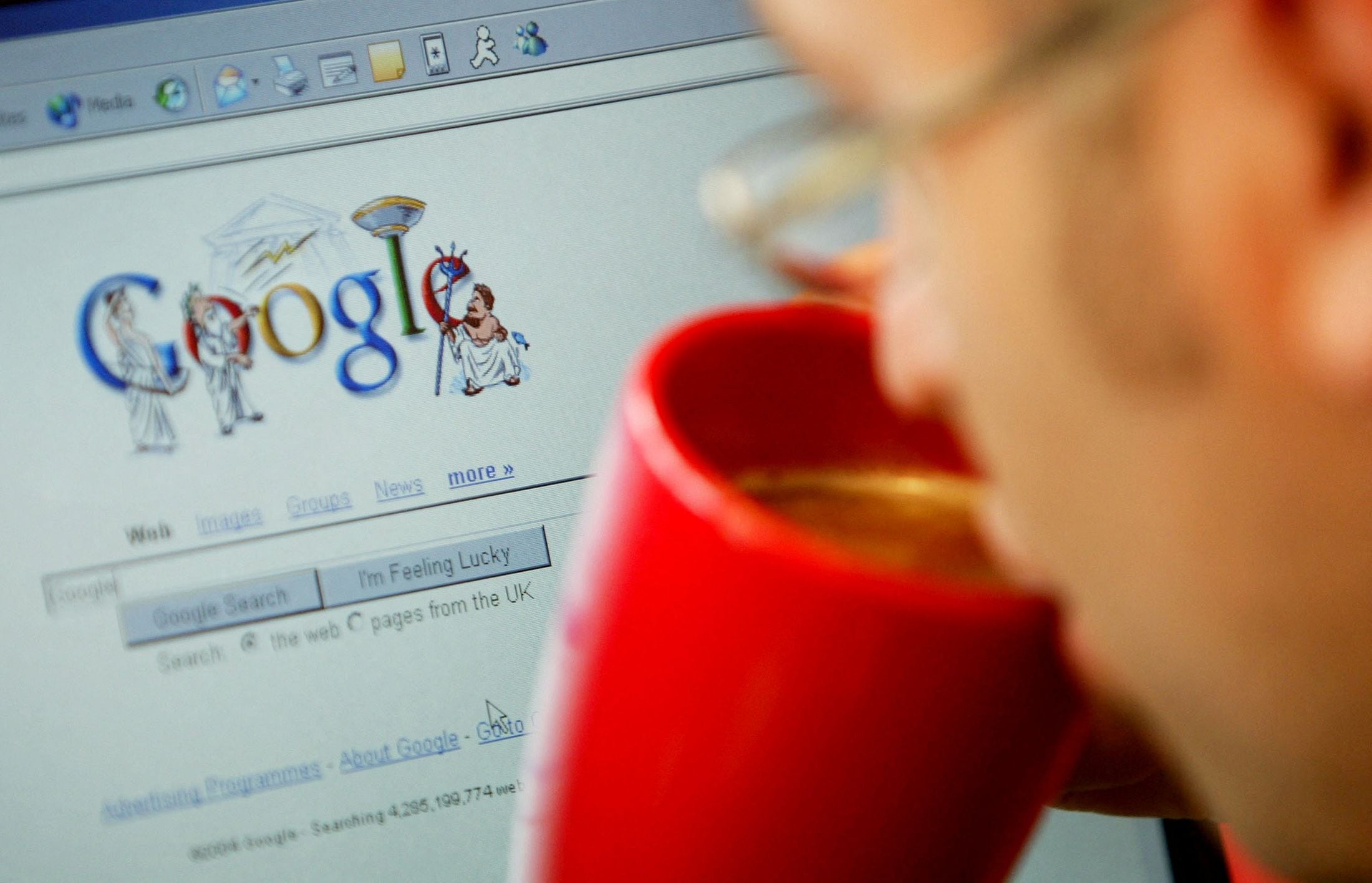 FILE PHOTO: An internet surfer views the Google home page at a cafe in London