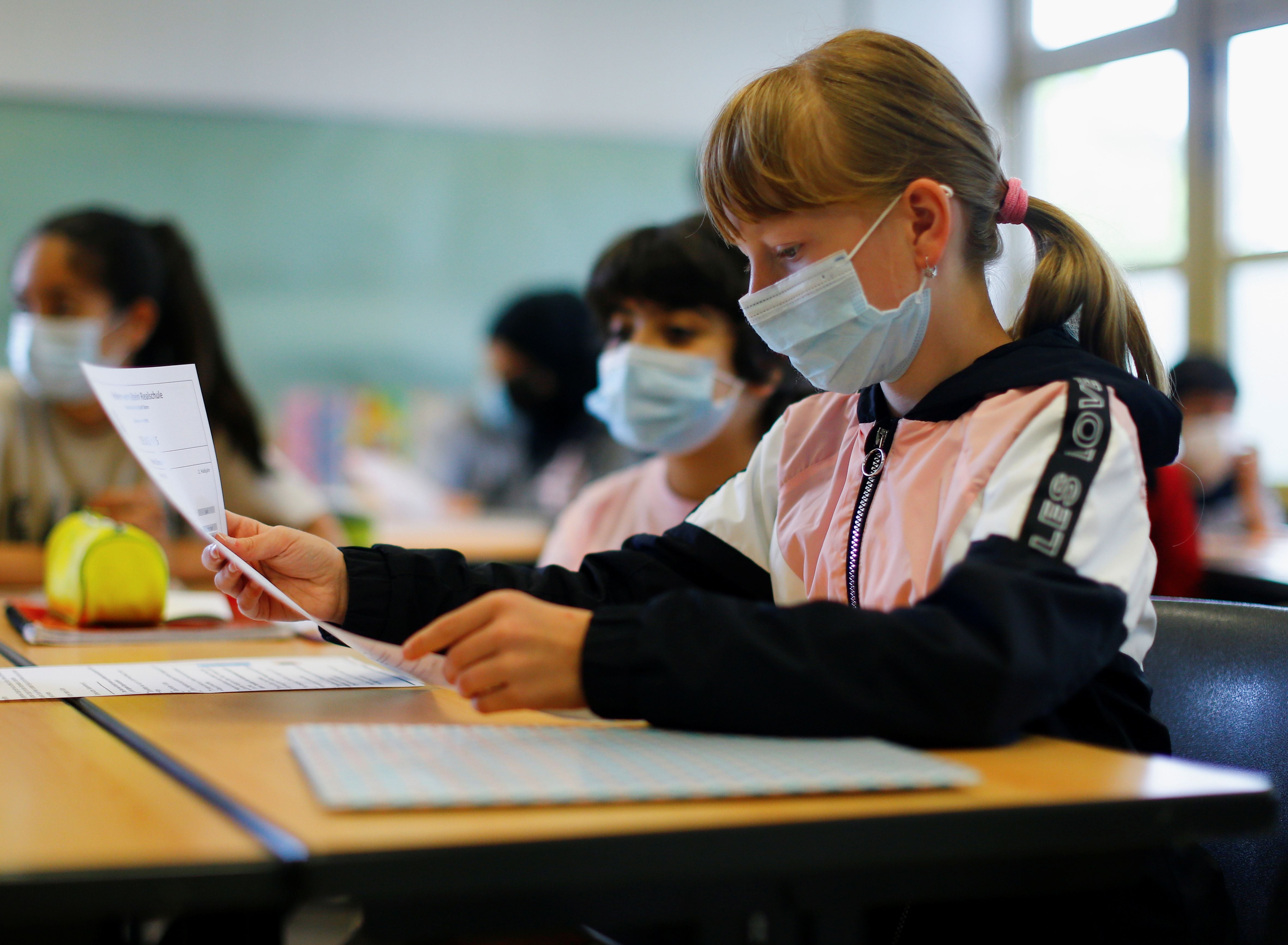 Pupils receive their annual school reports in Bonn