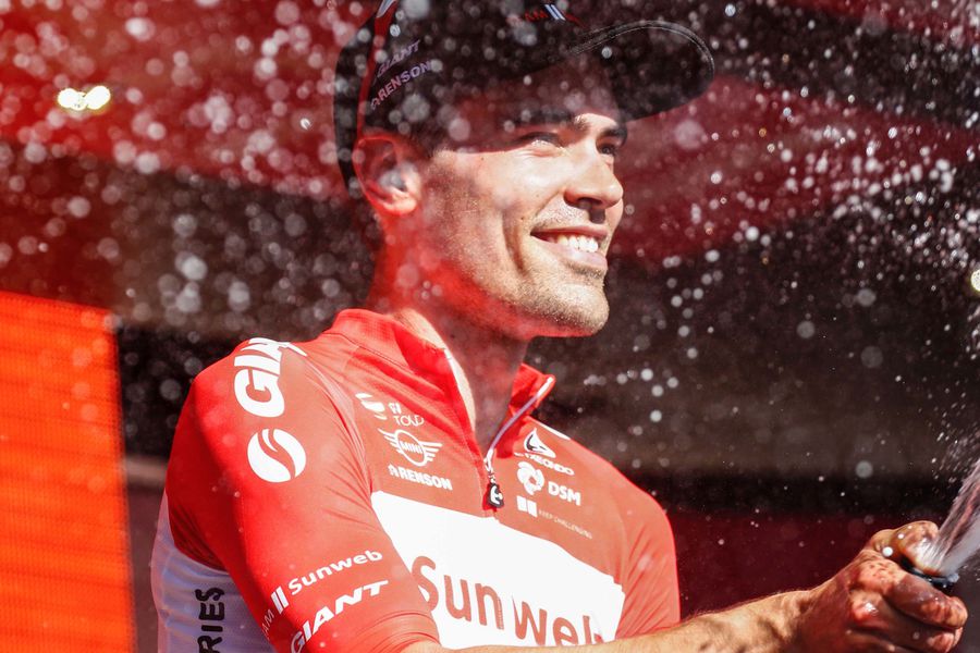 Dutch cyclist Tom Dumoulin from Team Sunweb sprays champagne as he ce