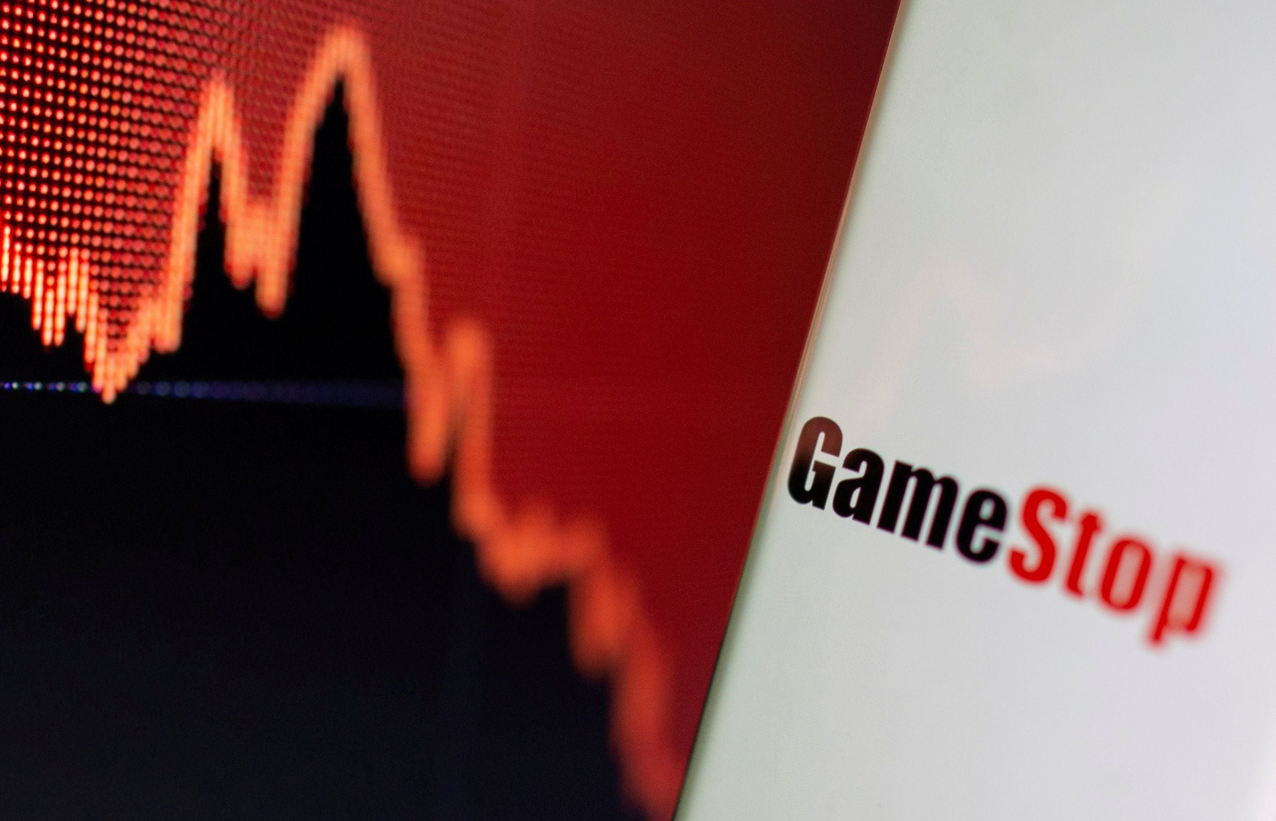 IFILE PHOTO: FILE PHOTO: GameStop logo is seen near displayed stock graph in this illustration