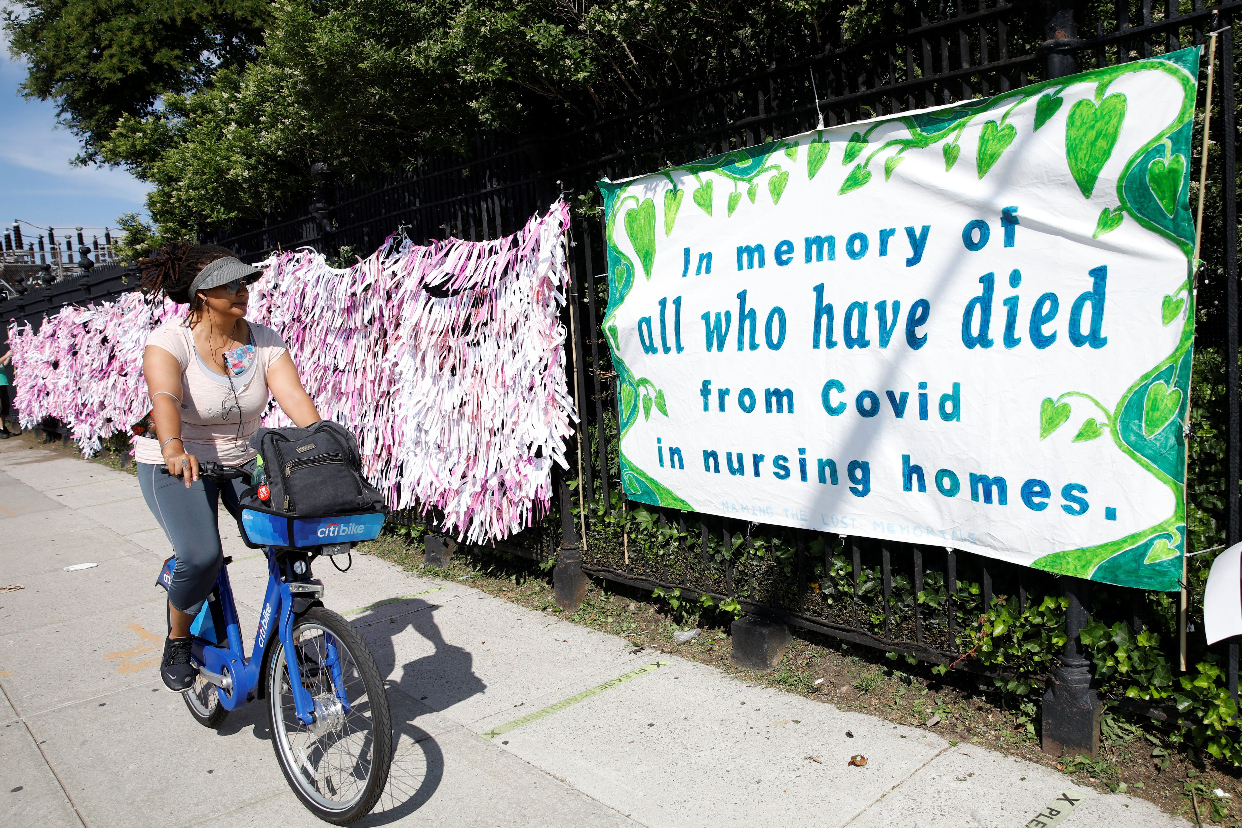 A woman looks at the "Naming the Lost Memorials," at The Green-Wood Cemetery in Brooklyn, New York