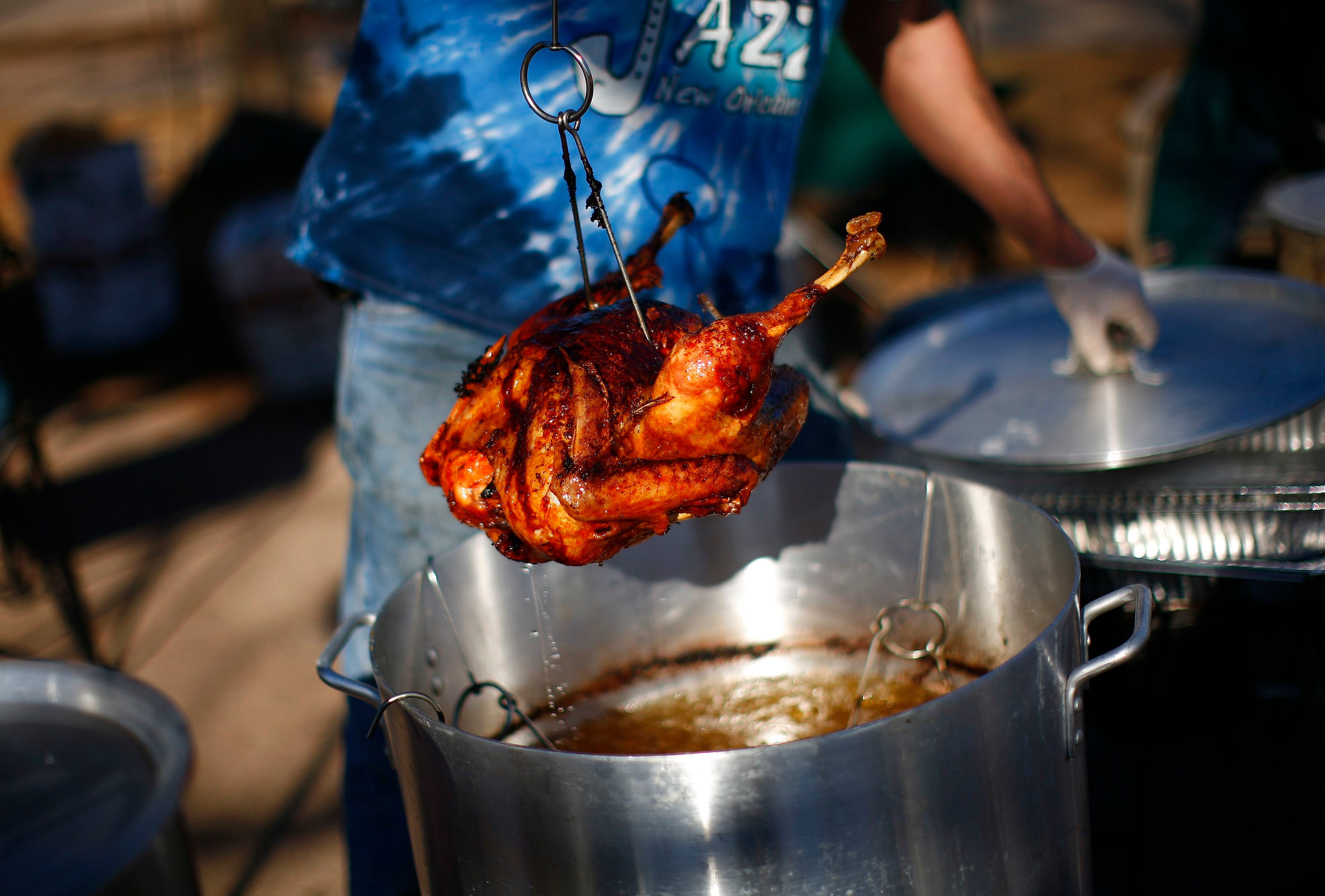 A volunteer deep fries a turkey for victims and volunteers of Hurricane Sandy in the Staten Island borough of New York