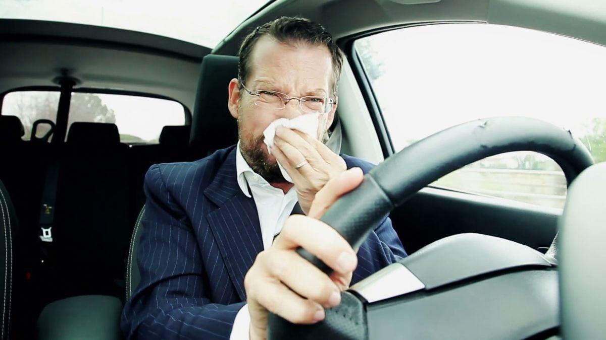 business-man-driving-car-sneezing-feeling-sick-fever_em_2gq3yl__F0005.jpg