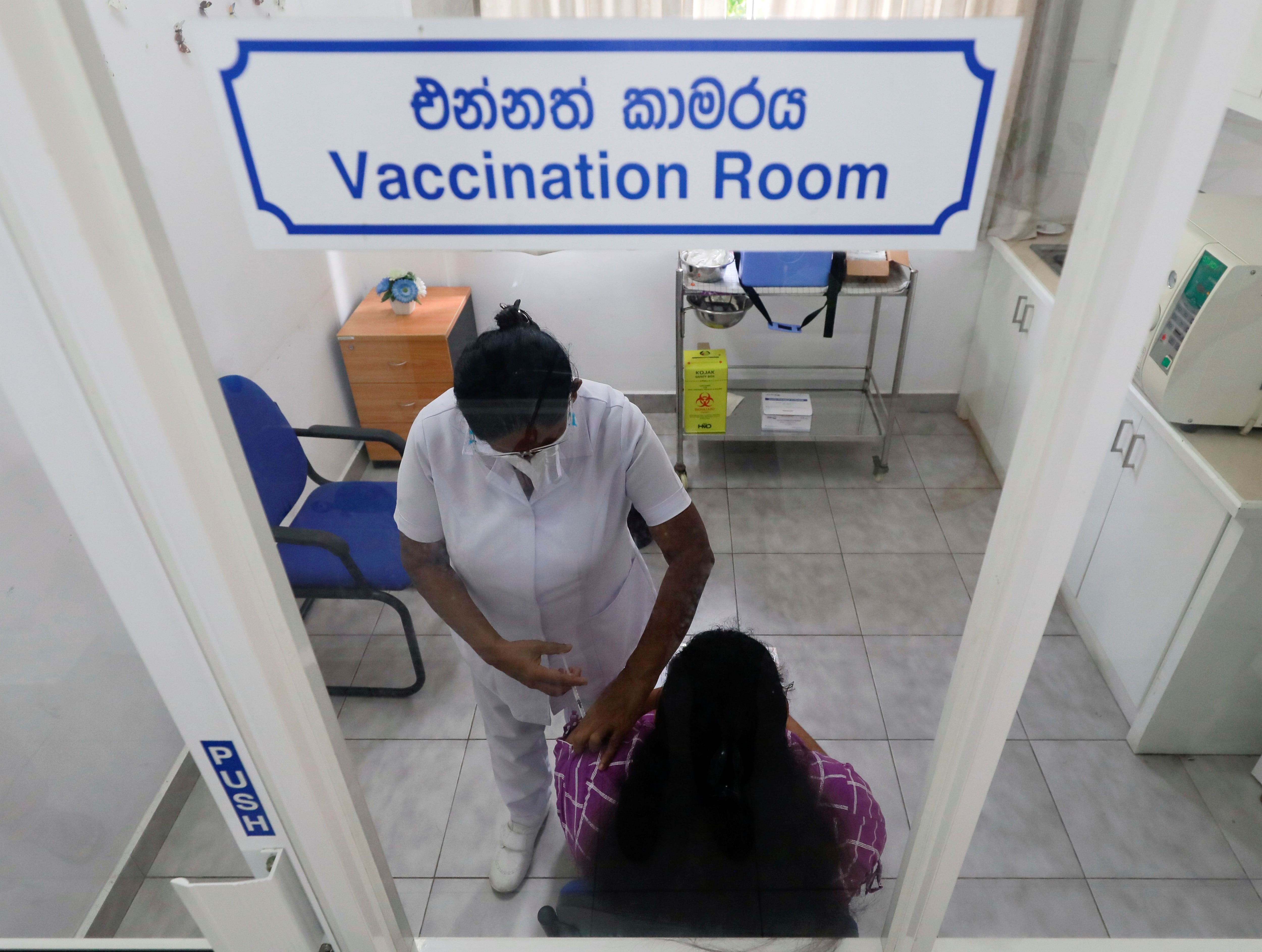 Pregnant women receive their vaccine against the COVID-19 for the first time, in Colombo