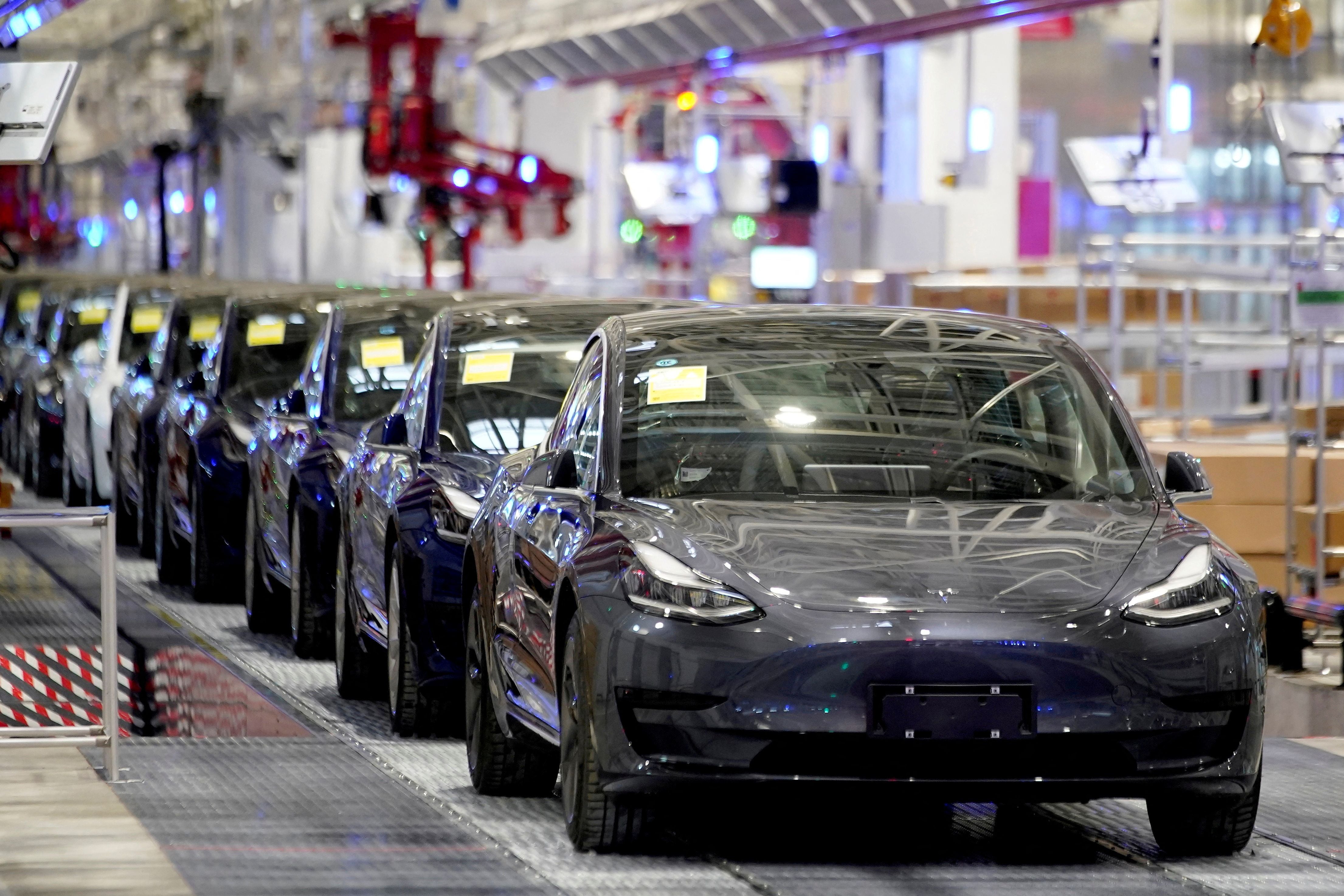 FILE PHOTO: Tesla Model 3 vehicles are seen during a delivery event at its factory in Shanghai