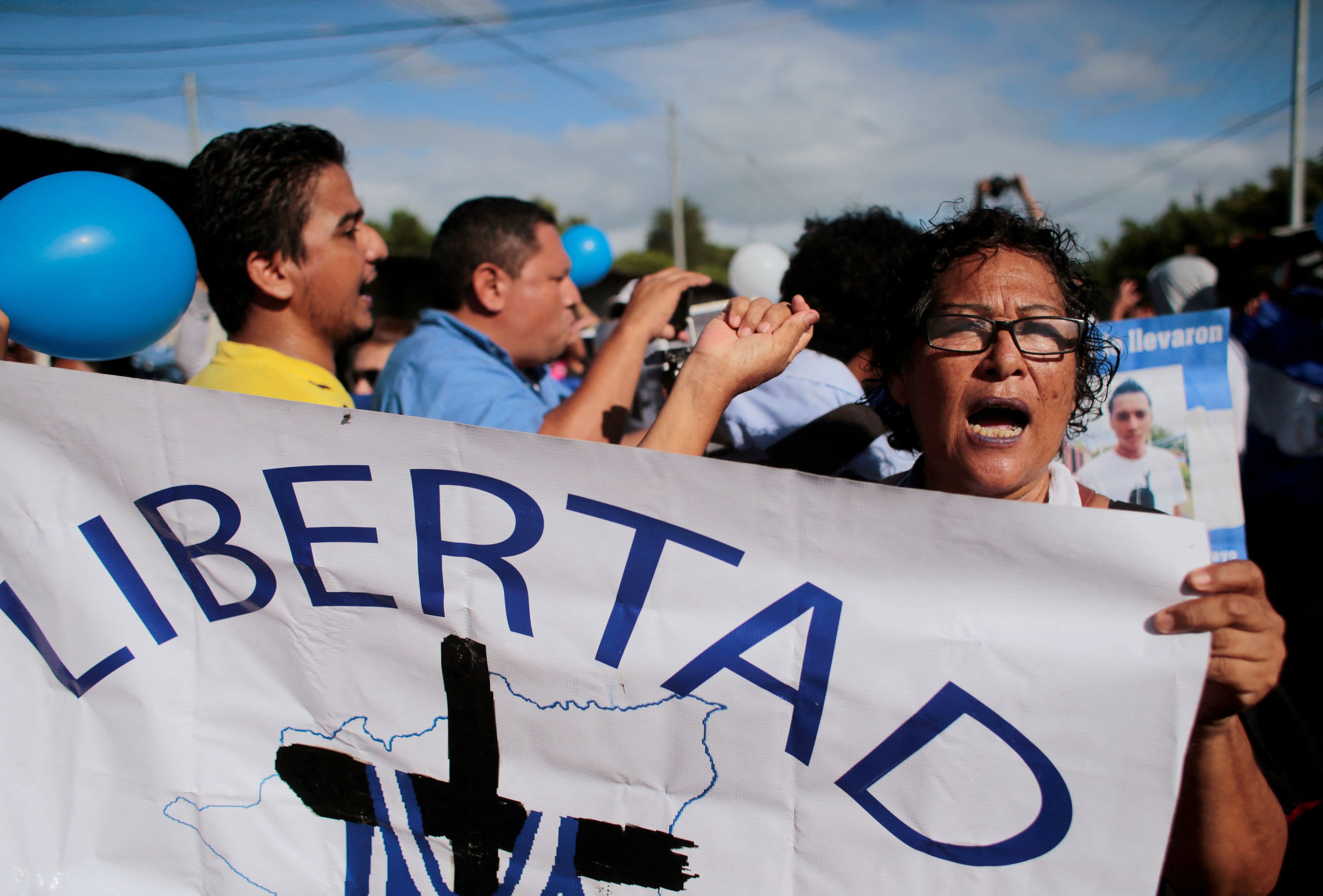 FILE PHOTO: A demonstrator takes part in a protest outside the "La Modelo" prison to demand the release of political prisoners in Tipitapa