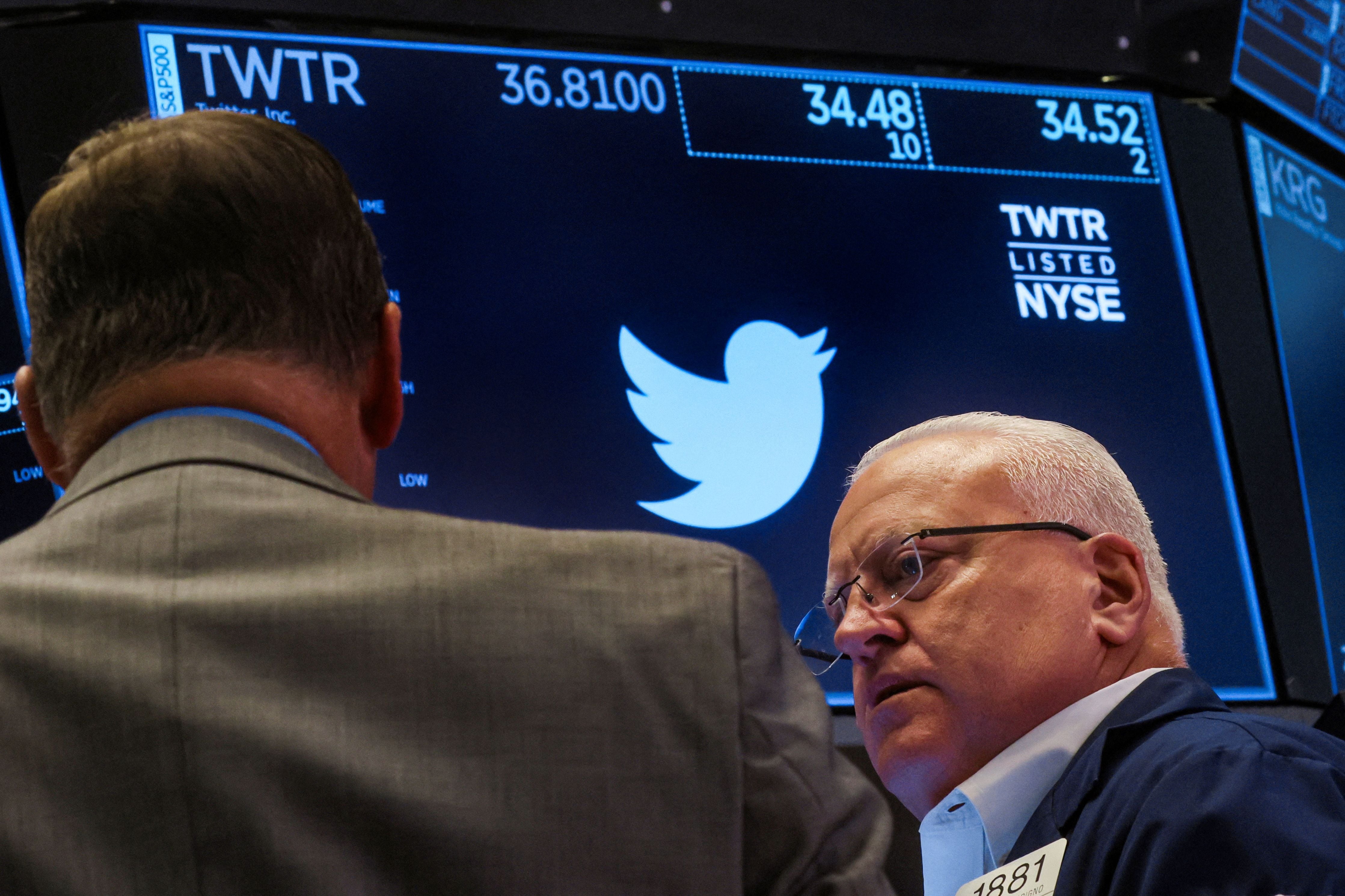 Traders work on the floor of the NYSE in New York