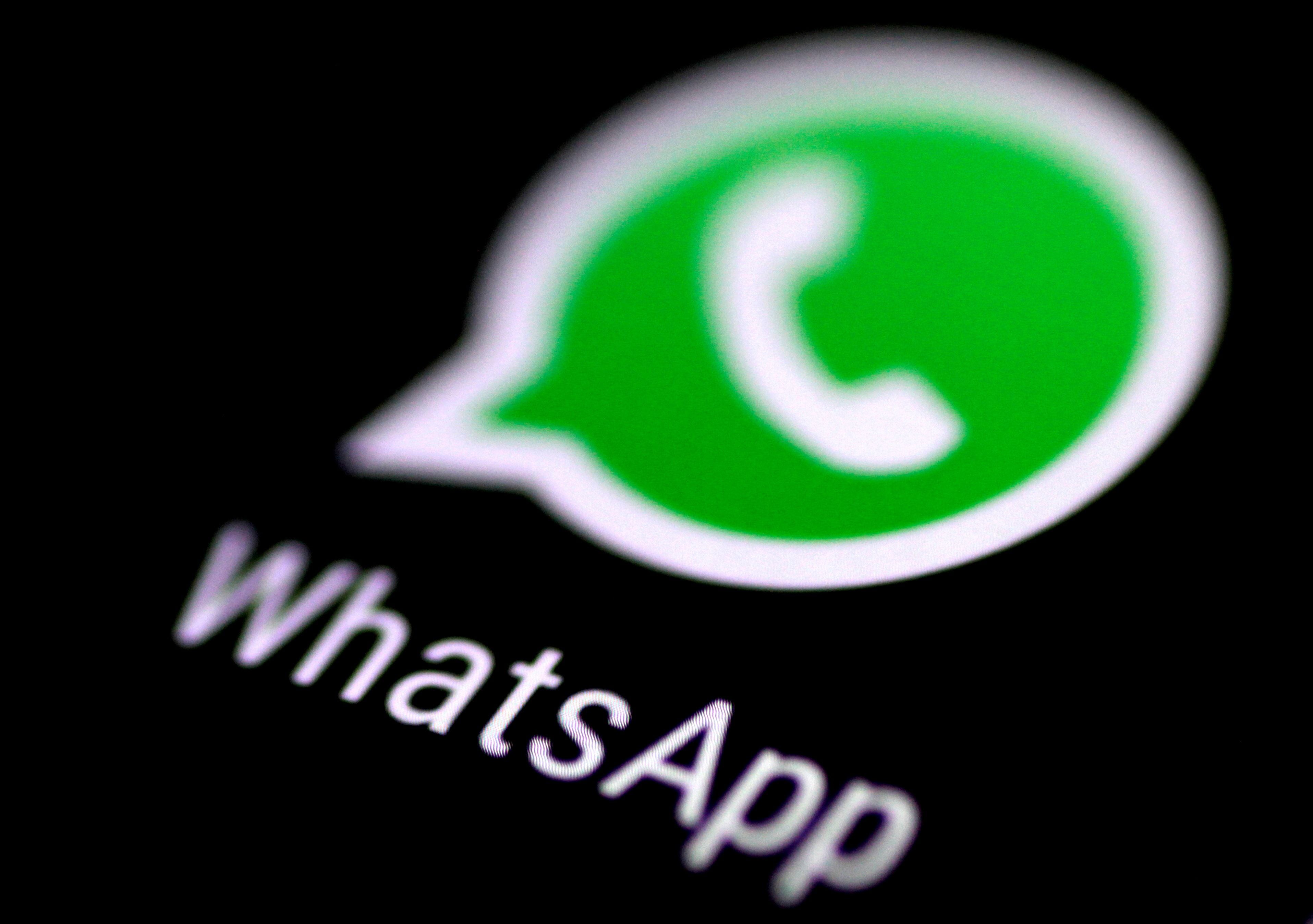 FILE PHOTO: FILE PHOTO: The WhatsApp messaging application is seen on a phone screen