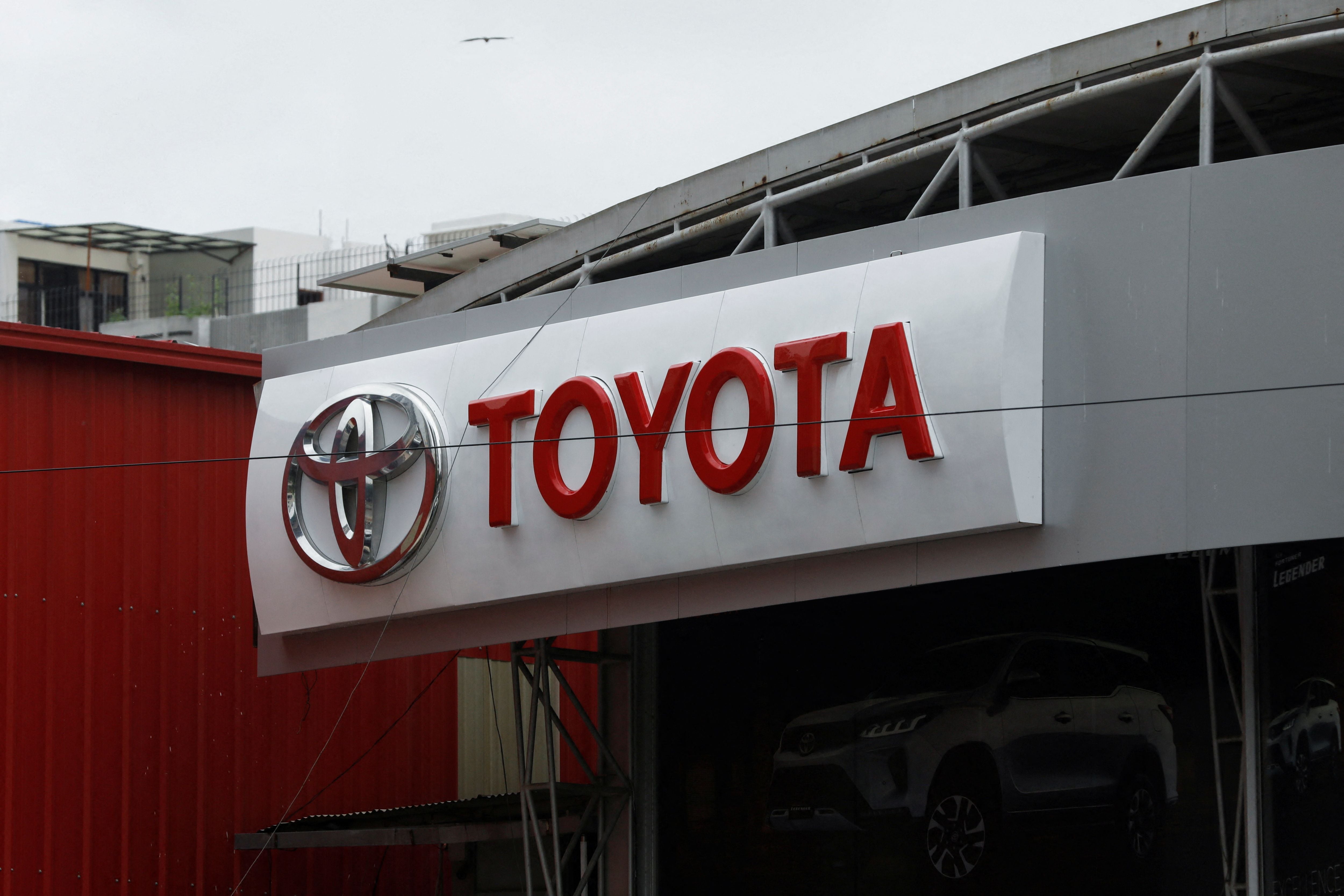 Toyota logo is seen at a Toyota Society Motors showroom, in Karachi